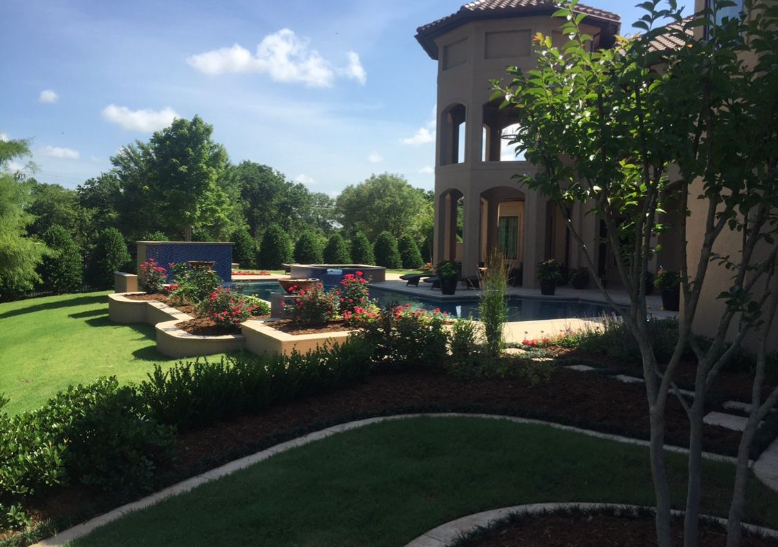 A large house with a swimming pool in the backyard