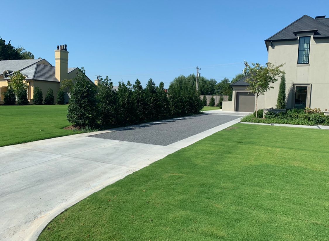 A large house with a driveway leading to it