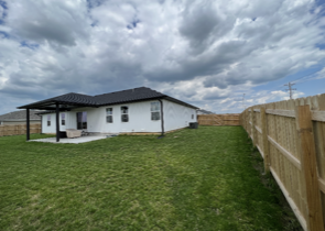Grassy Field with House | Bolivar, MO | Clay Landscaping, LLC