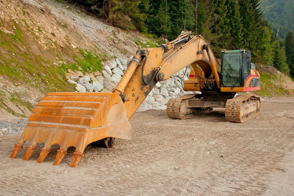 a backhoe truck on the site field