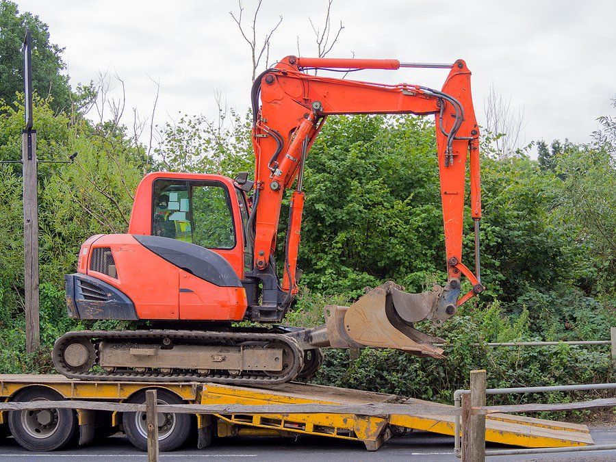 an orange backhoe truck