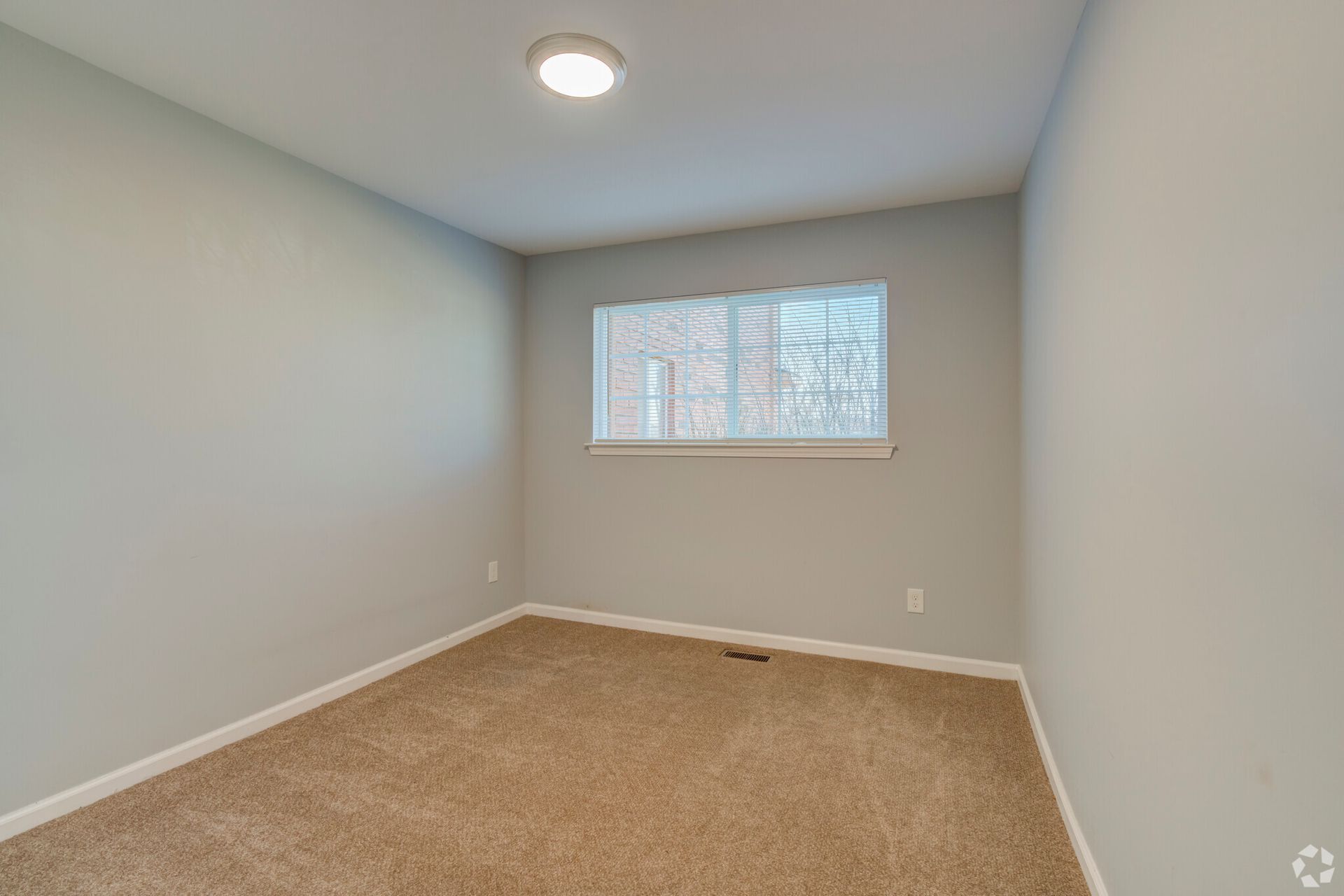 There is a large window in the middle of the room.