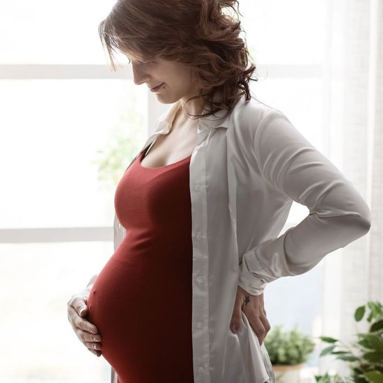 Pregnant Woman on Red Dress — Saginaw, MI — Swartz Adoption Agency
