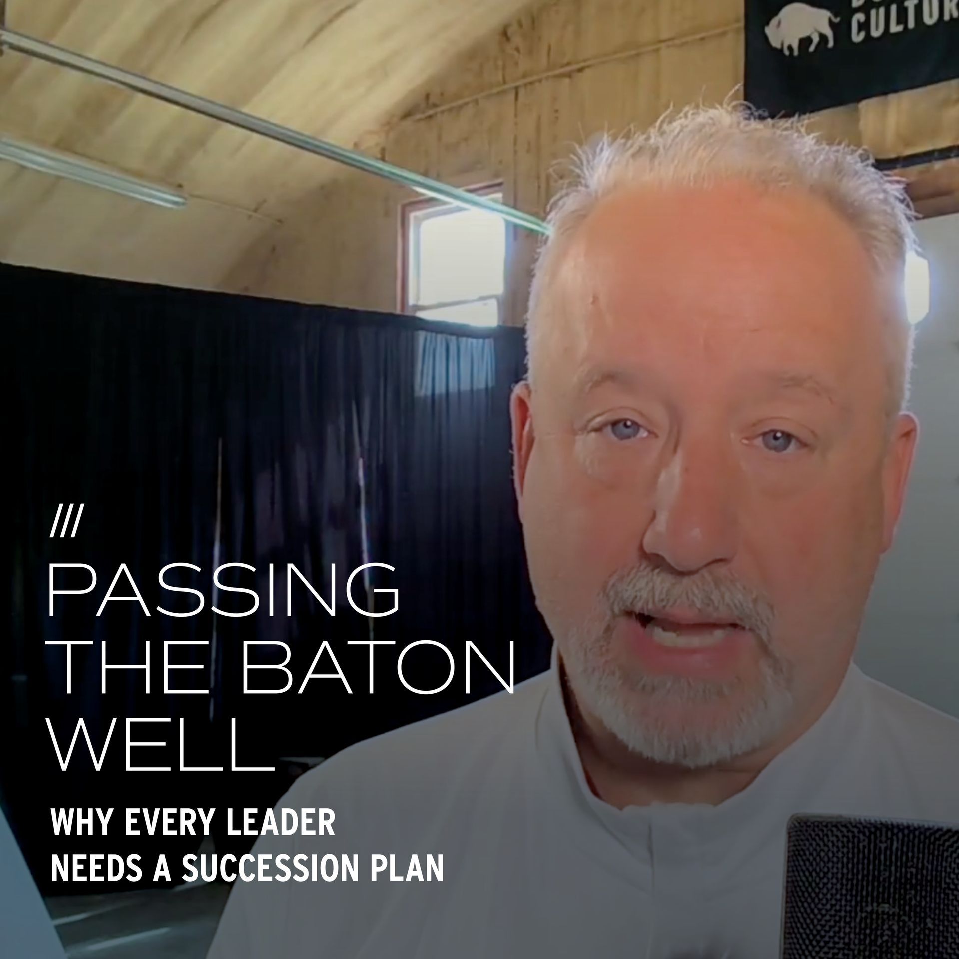 Man speaking, text reads 