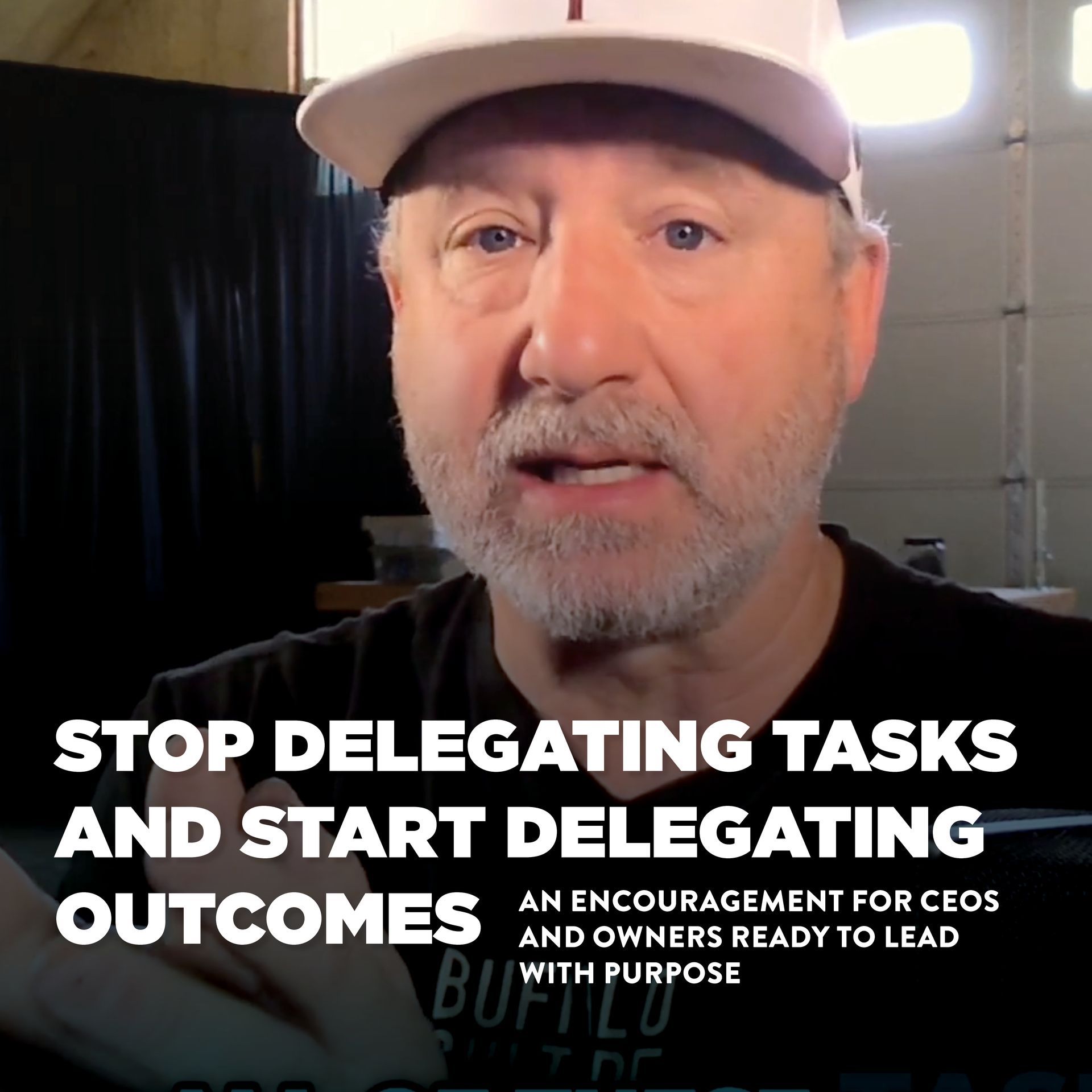 Man in a cap speaking, text: