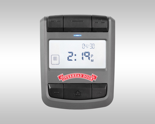 Gray handheld electronic device with a digital clock display and red logo beneath the screen.