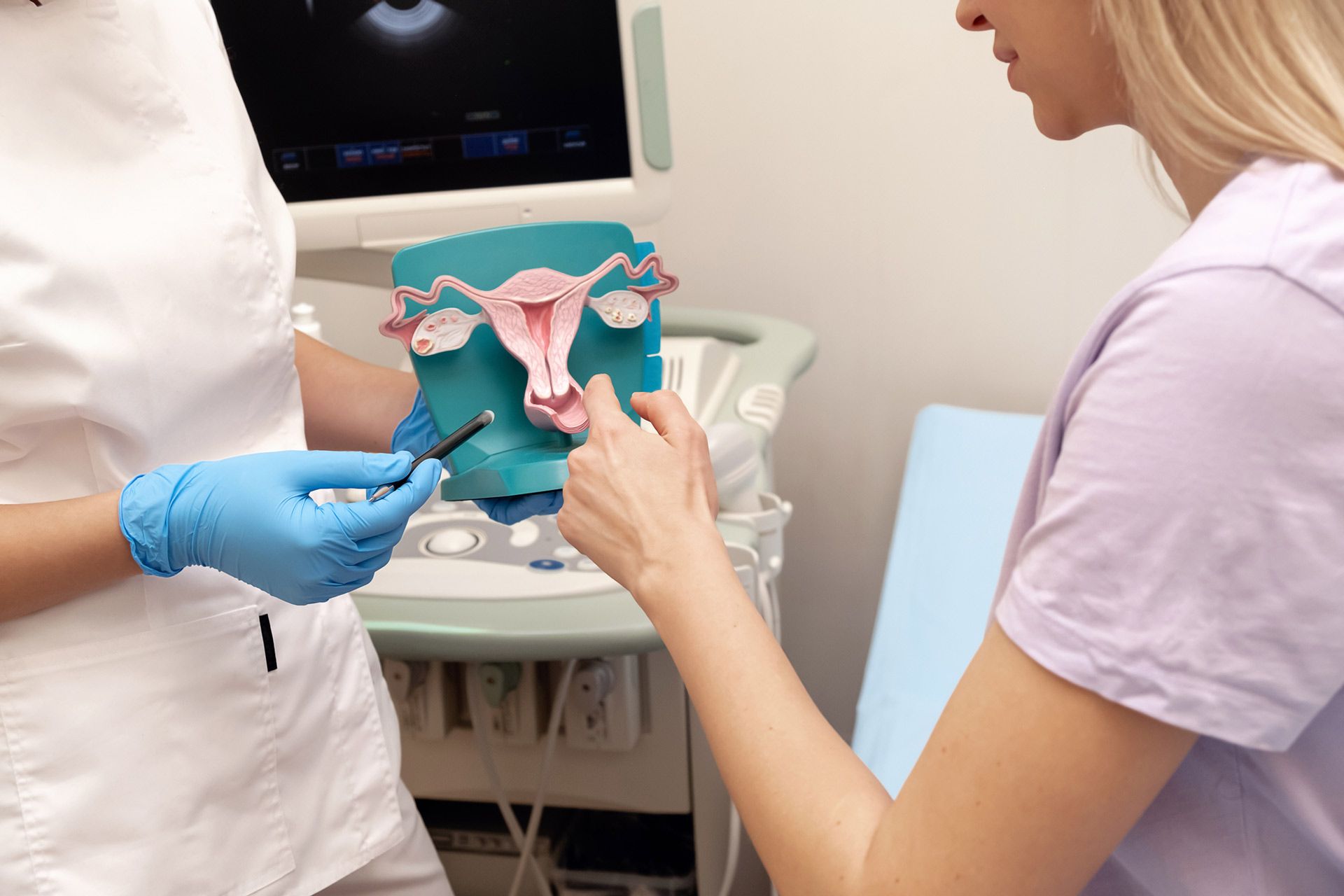 A woman pointing a ovary model — Wheeling, WV — Leigh Anne Massey, MD