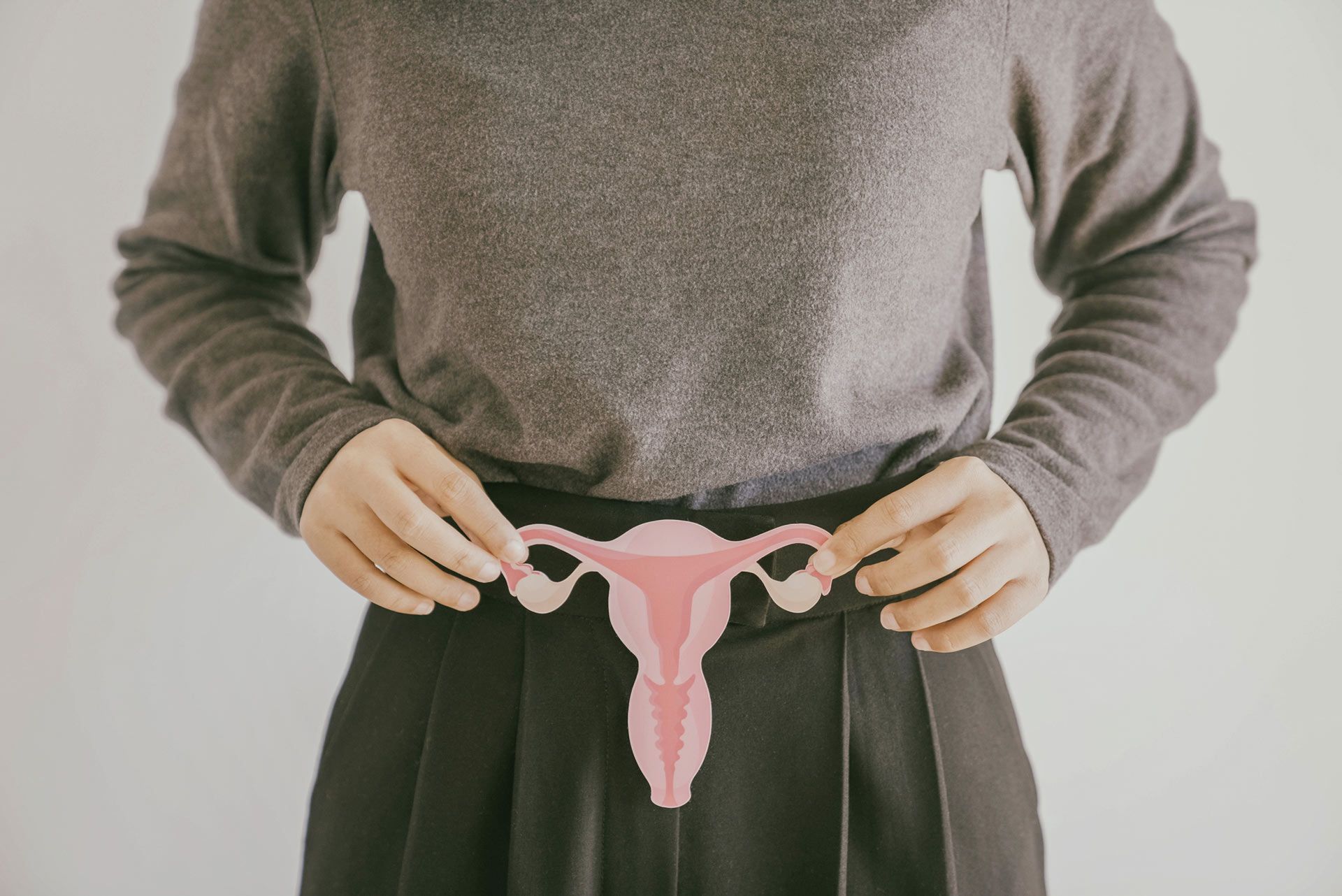 A woman holds a pink ovary model — Wheeling, WV — Leigh Anne Massey, MD