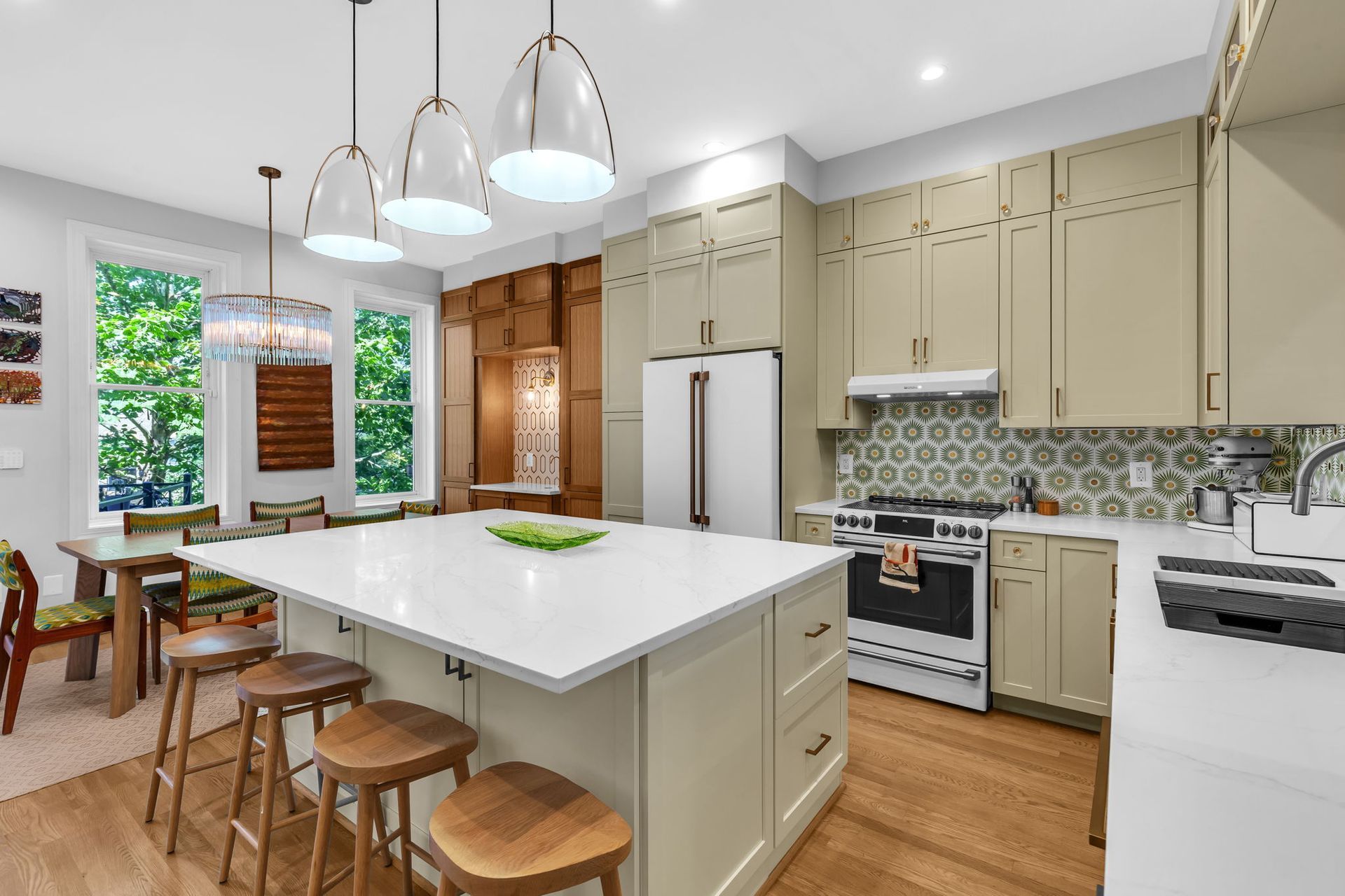 mid-century modern kitchen remodel with custom cabinets, large island, and patterned backsplash in historic Washington DC home