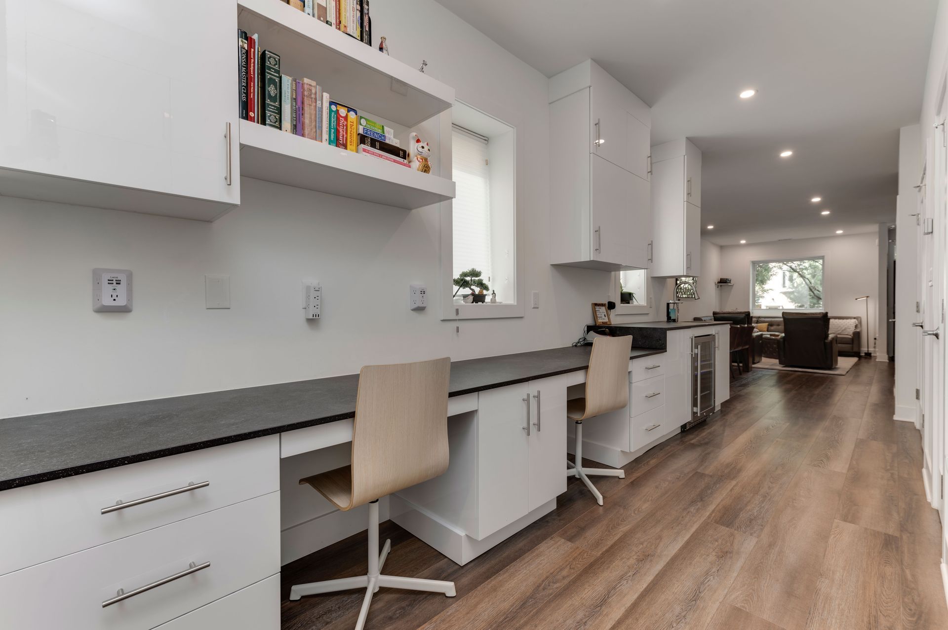 Modern kitchen with integrated home office and dual workstations