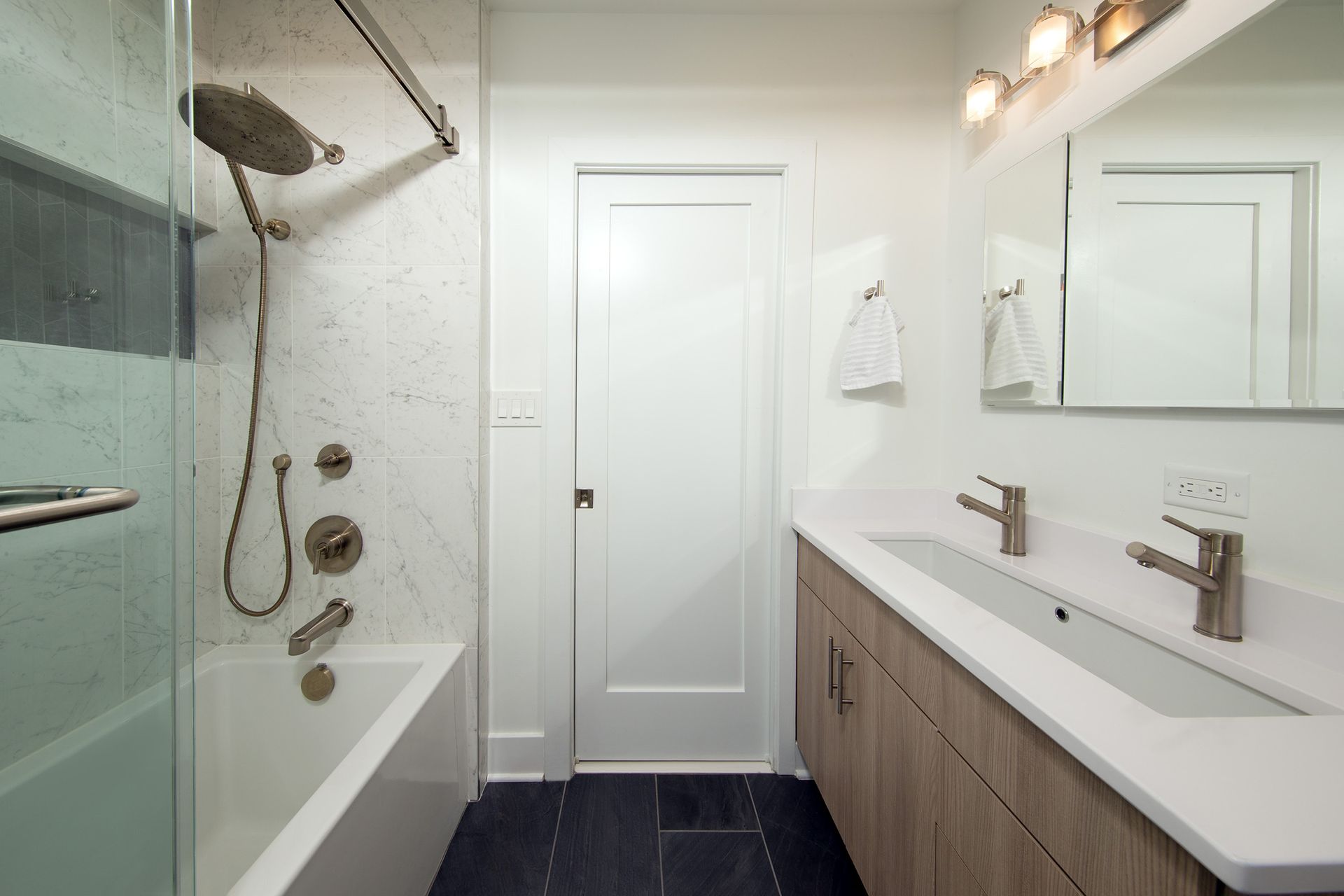 modern bathroom remodel with walk-in shower and double vanity in washington dc historic home renovation