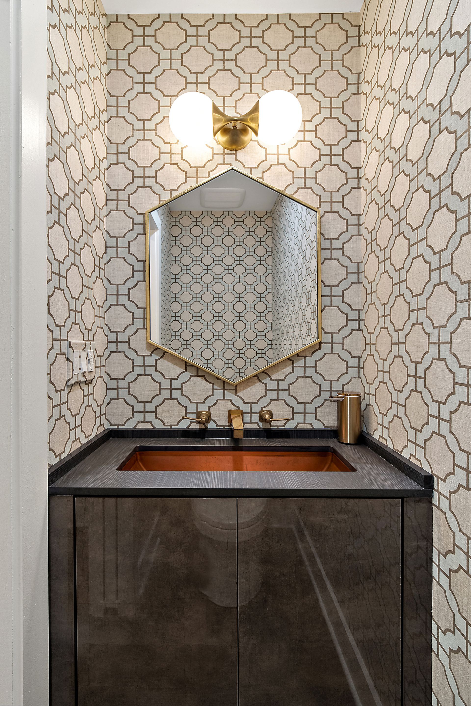 White herringbone kitchen backsplash with white cabinets, modern induction cooktop, and stainless steel range hood