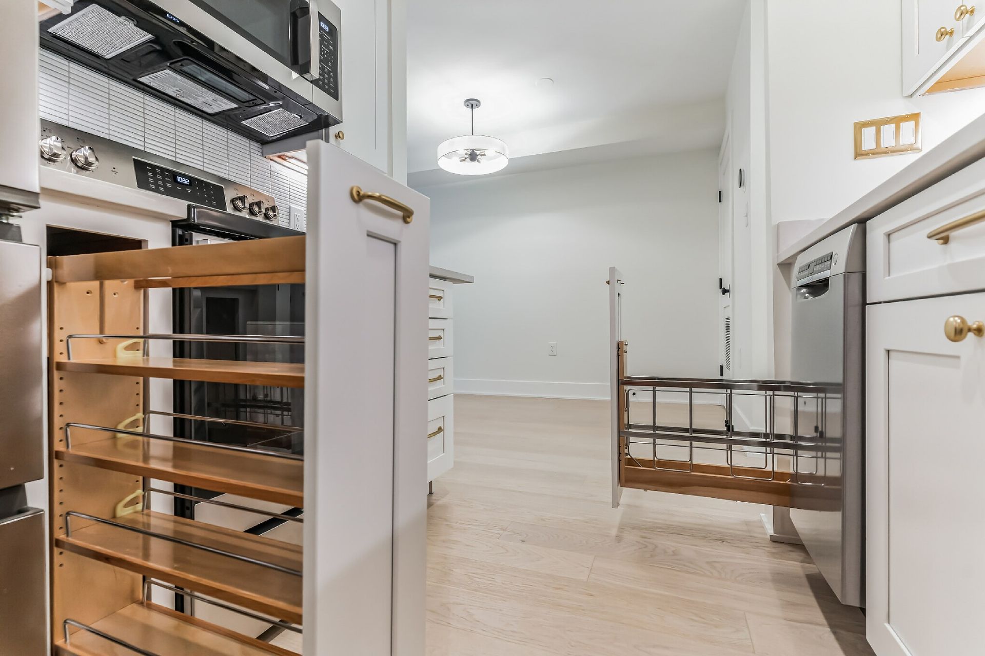 pull out kitchen pantry trash cabinet storage white shaker cabinets gold hardware modern remodel