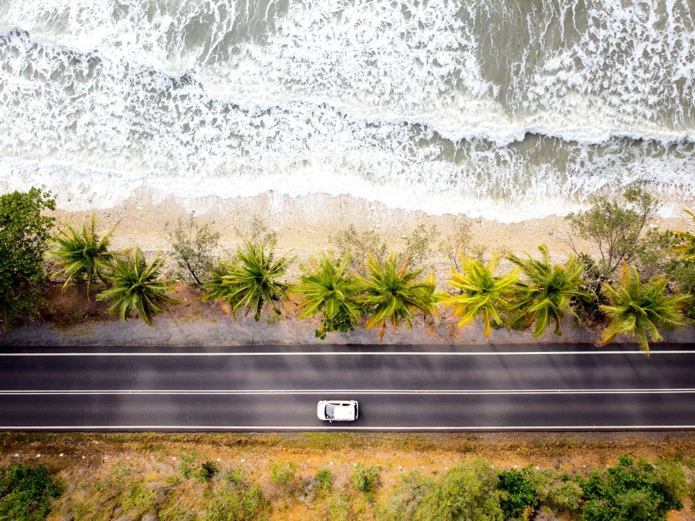 Overhead View Of A Coastal Road With A White Car — Ace Fridge Door Seals In Port Douglas, QLD