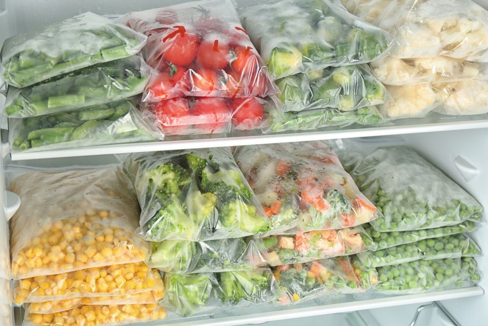 Freezer Shelves Filled With Plastic Bags Of Frozen Vegetables — Ace Fridge Door Seals in Atherton Tablelands, QLD