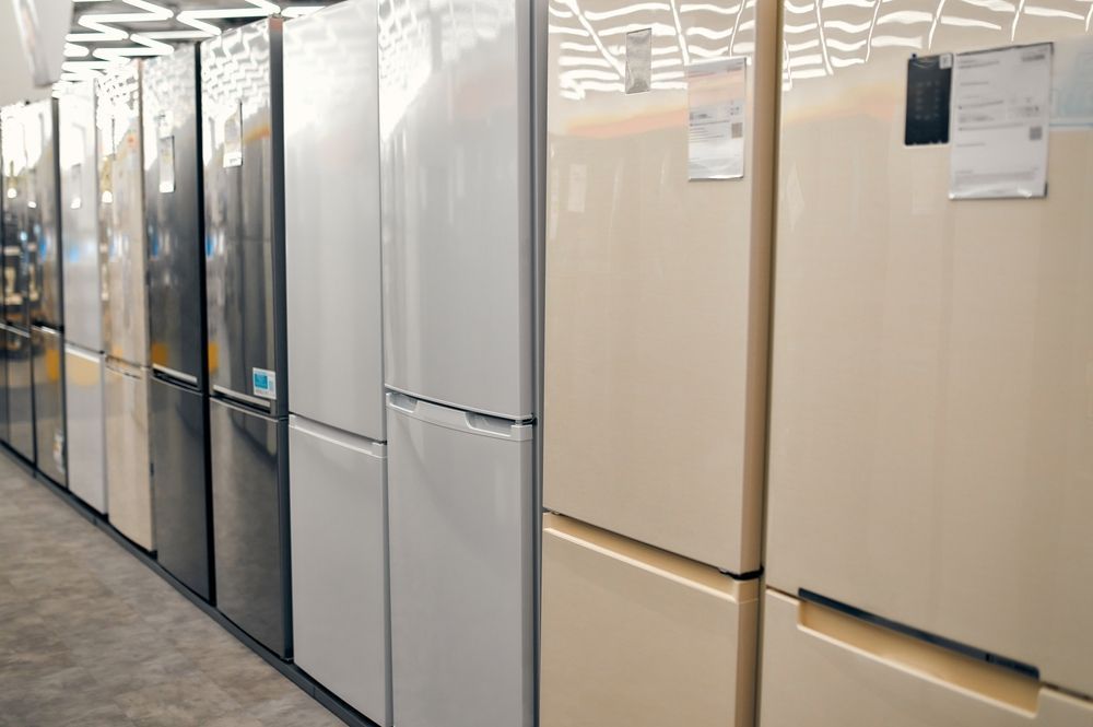 Refrigerators On Display In A Store, Various Colors Including White — Ace Fridge Door Seals in Port Douglas, QLD