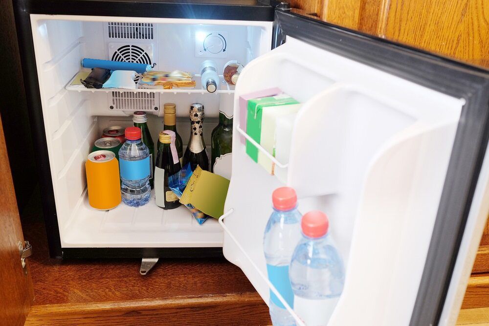 A Small Refrigerator Filled With Bottles , Cans , And Water — Ace Fridge Door Seals In Cairns, QLD