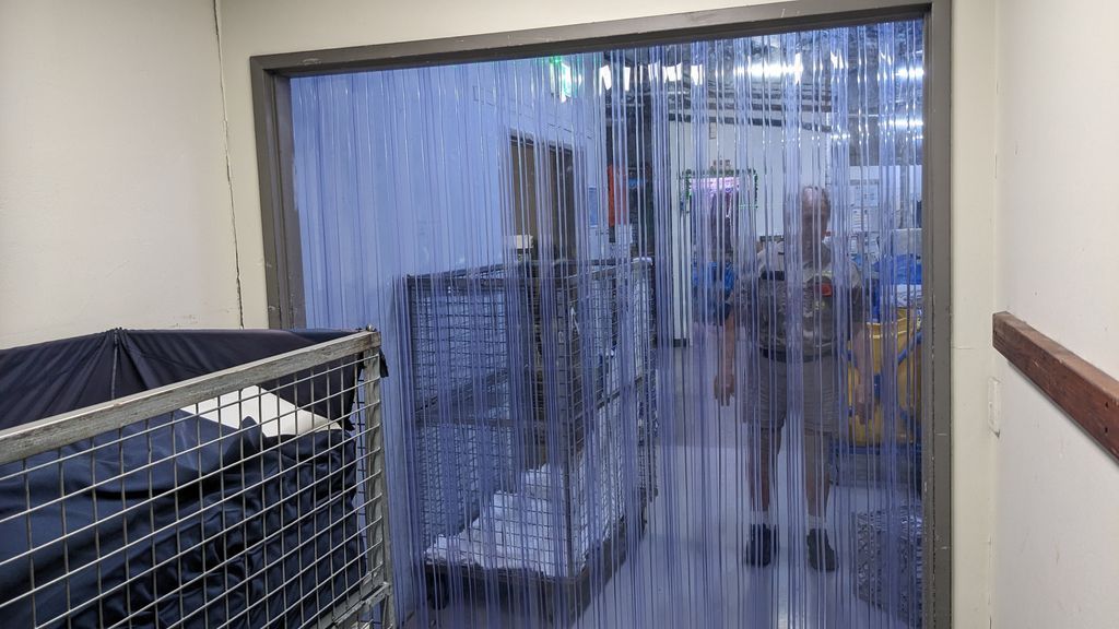 Doorway With Hanging Clear Plastic Strip Curtain — Ace Fridge Door Seals In Cairns, QLD