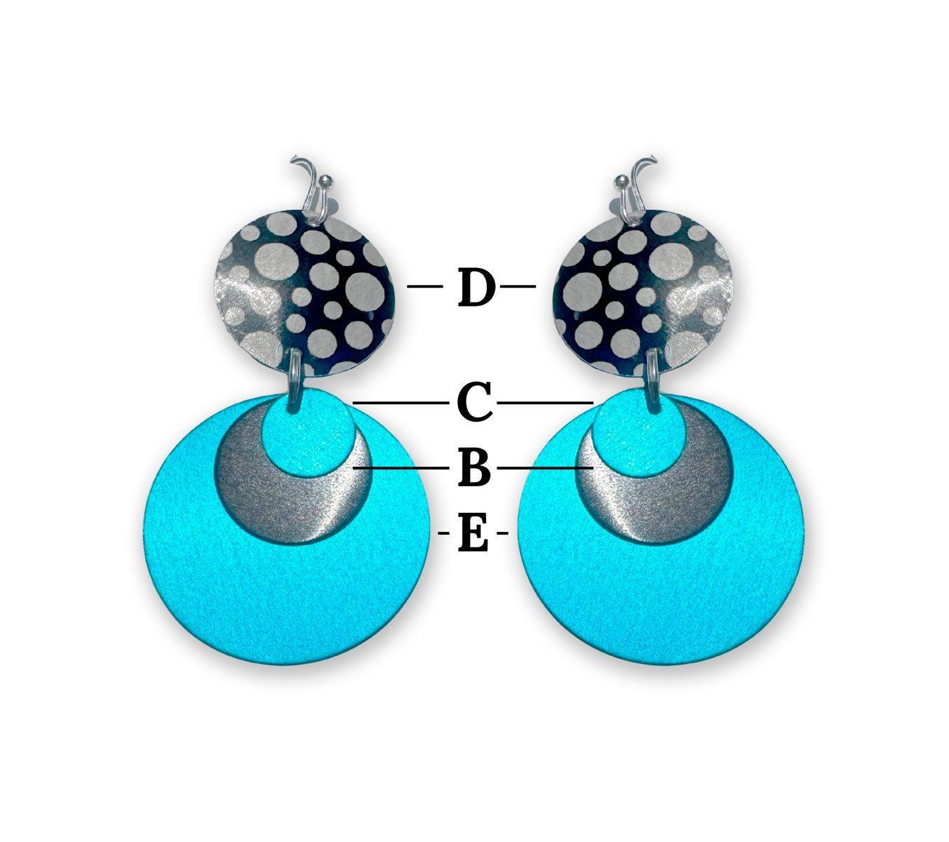 Woman wearing patterned earrings and beaded necklace, blue scarf.