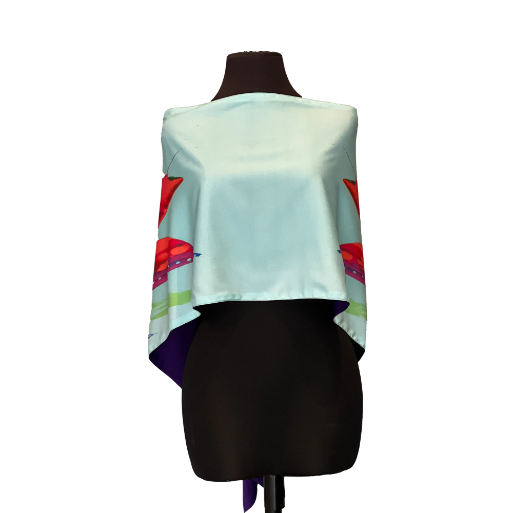 Light blue silk shawl on a black dress form, featuring a colorful butterfly design.