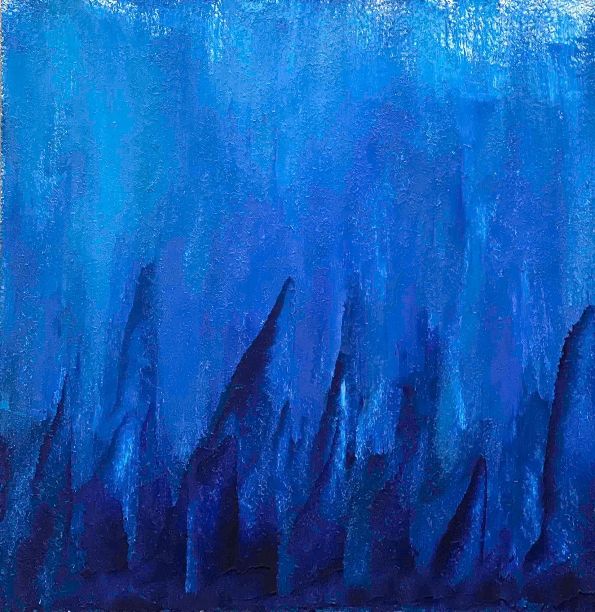 Blue and black patterned shoulder wrap on a black mannequin, with a blue watercolor effect.