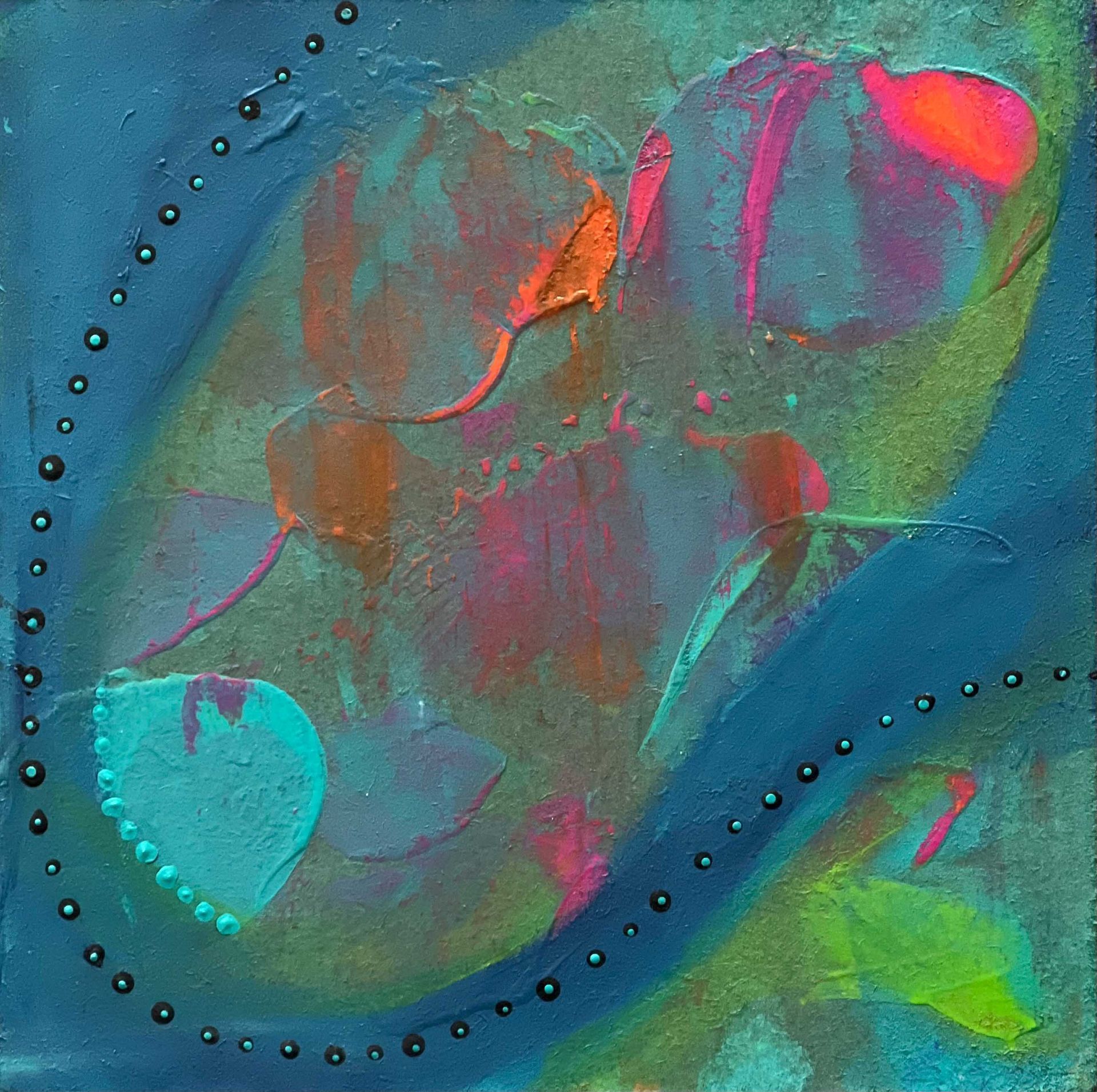 Silk scarf in blue, green, and pink, draped over a mannequin.