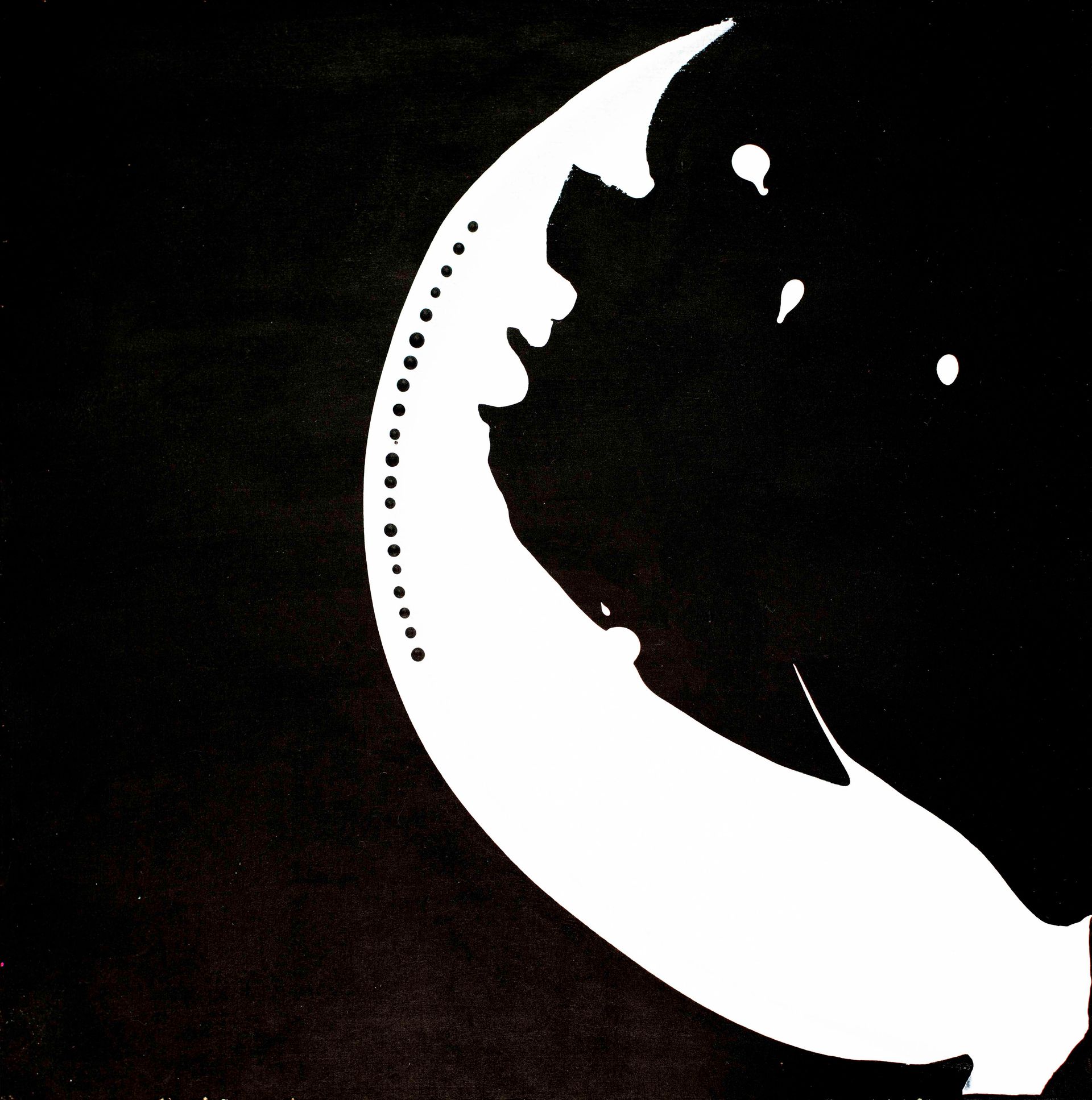 Black and white scarf draped over a black mannequin, with a white abstract design.