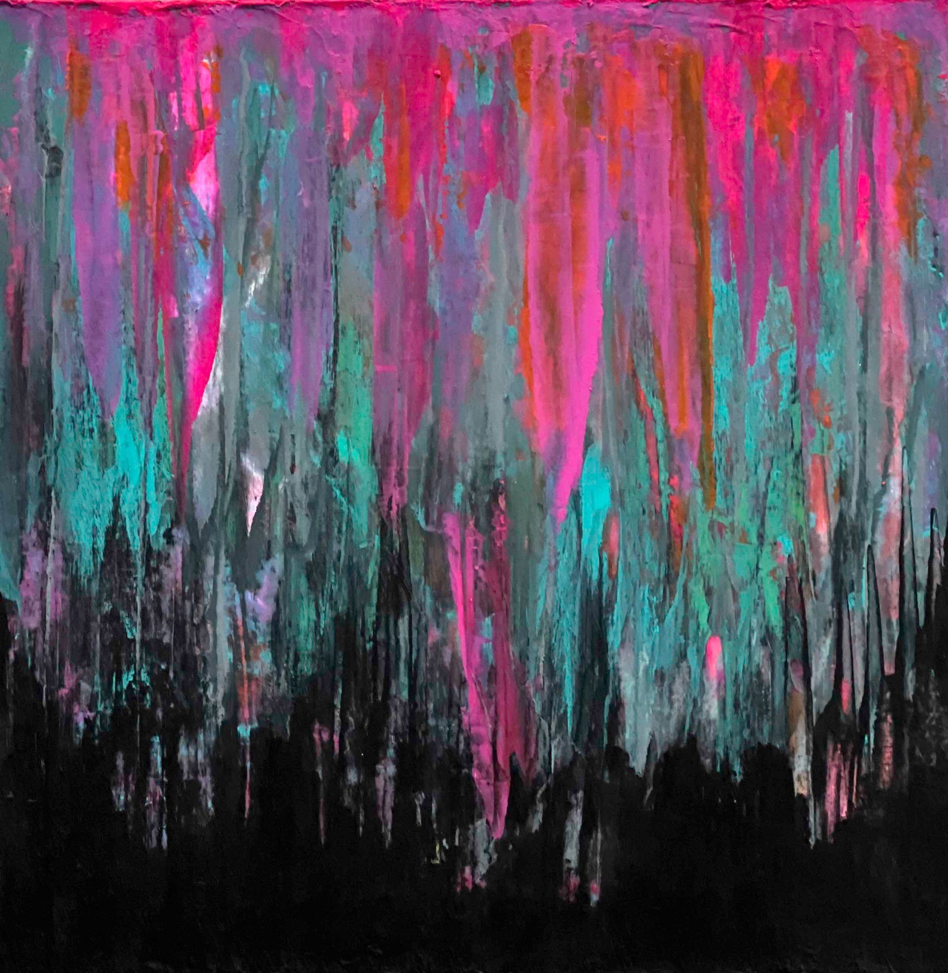 Colorful patterned scarf draped over a black mannequin.