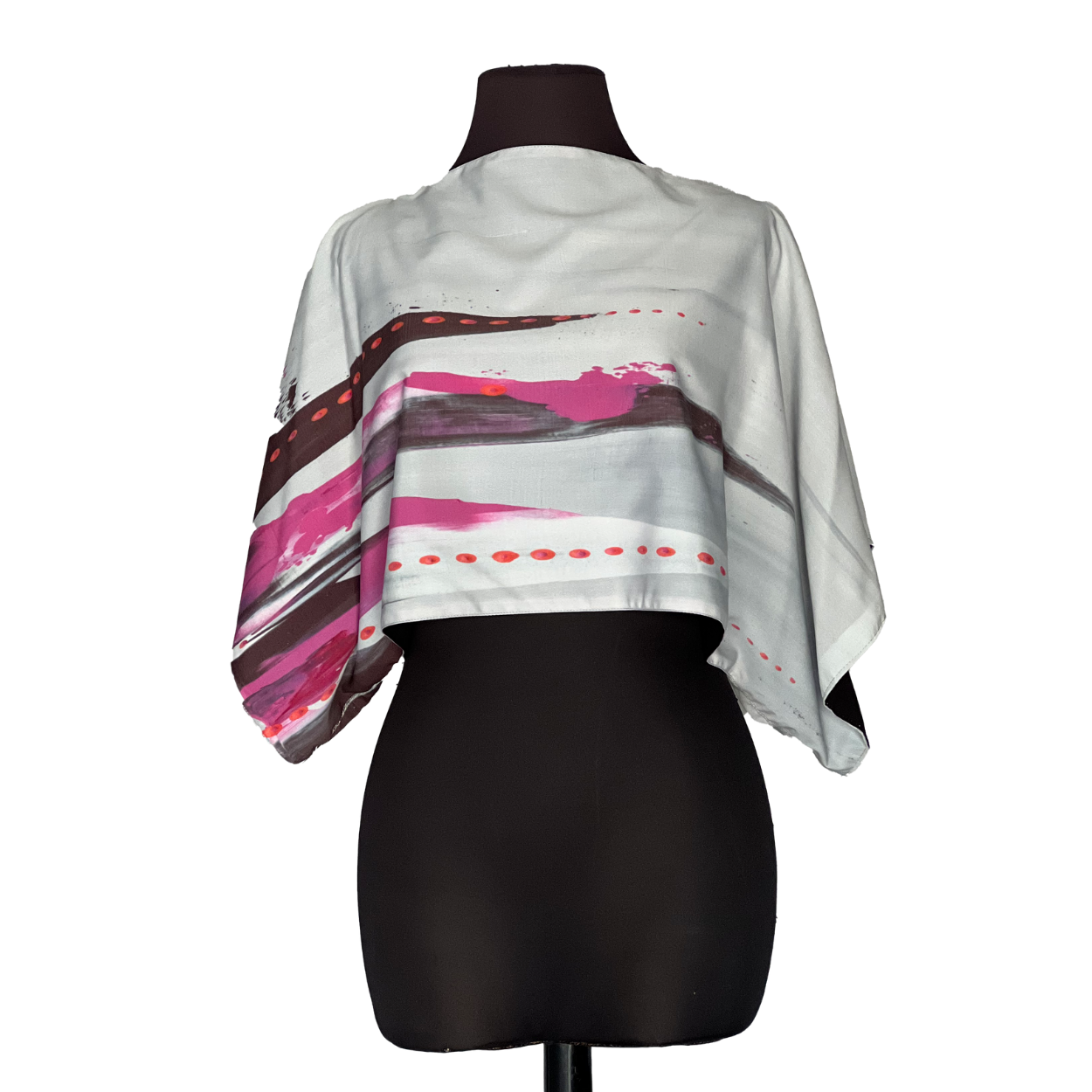 Light gray and pink abstract print crop top on a black mannequin.