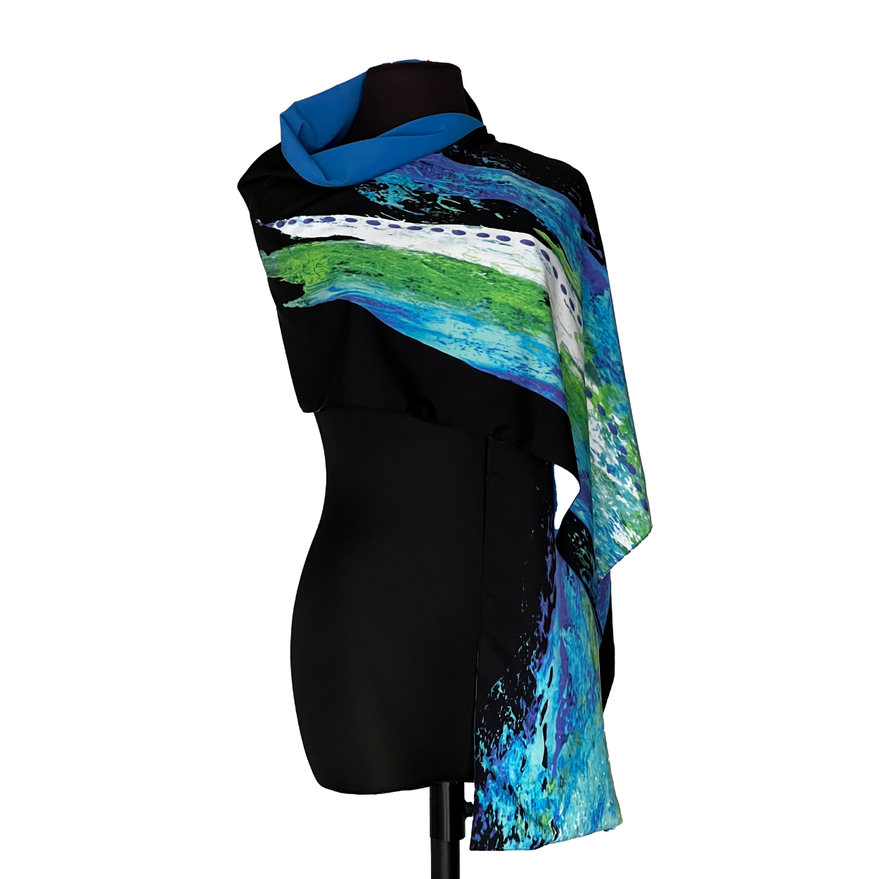 Black mannequin wearing a scarf with blue, green, and white brushstrokes.
