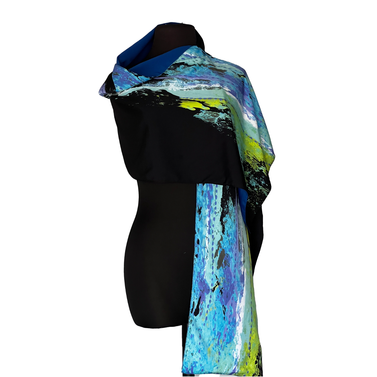 Black shawl with blue and green abstract design draped on a mannequin.