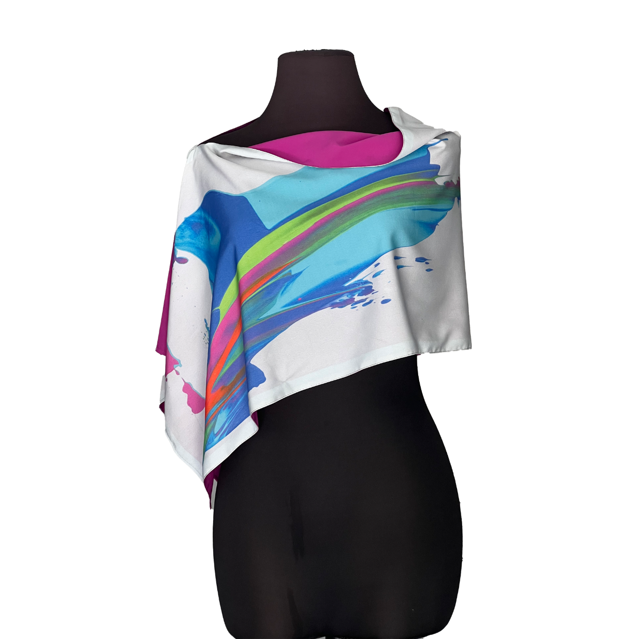 White shawl with blue and rainbow paint strokes draped over a black mannequin.