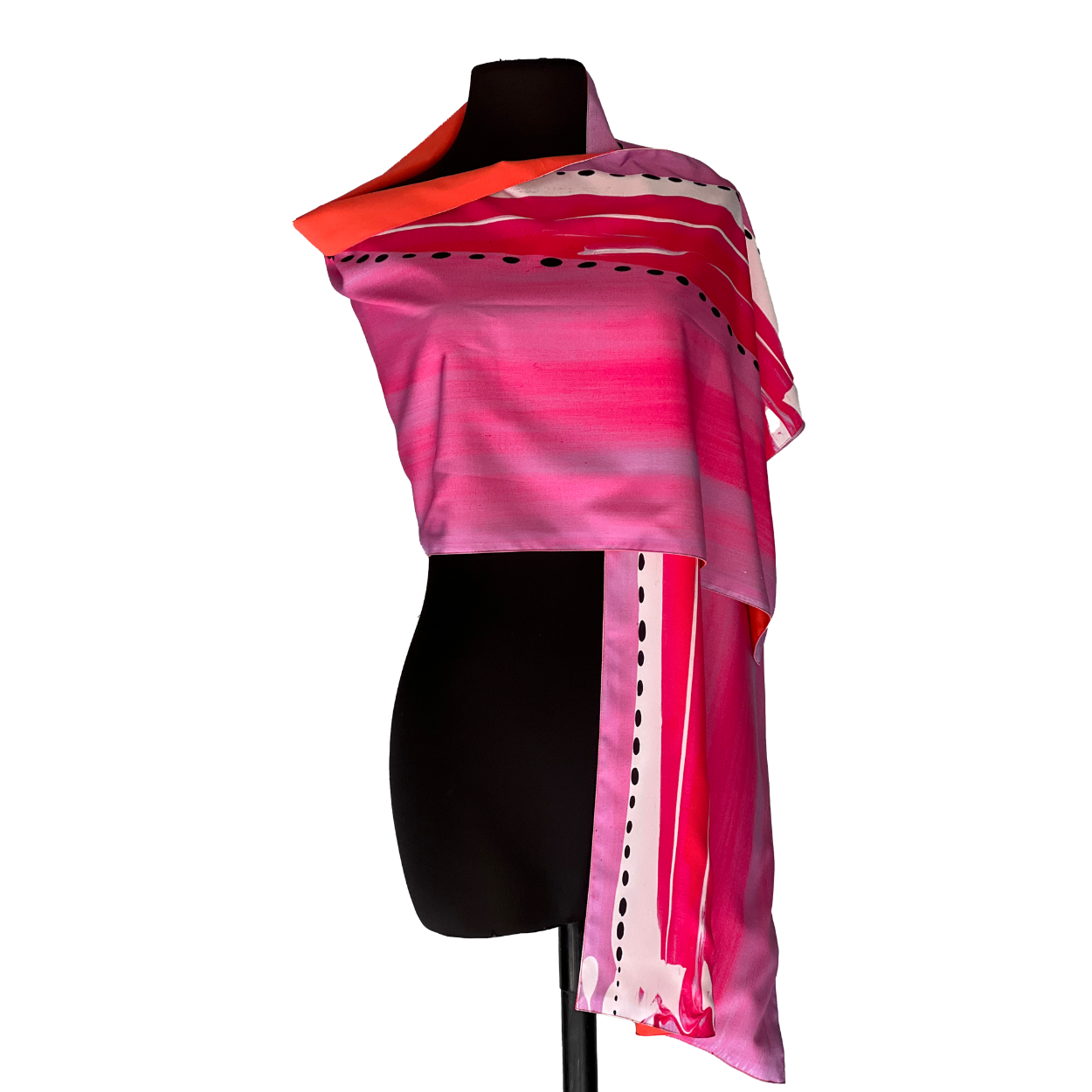 Pink and orange silk scarf draped on a black mannequin.