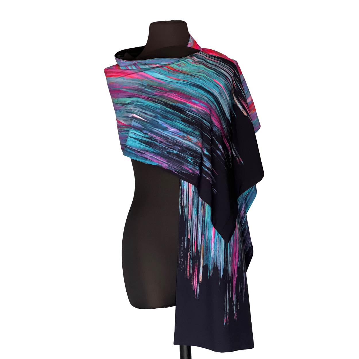 Colorful patterned scarf draped over a black mannequin.