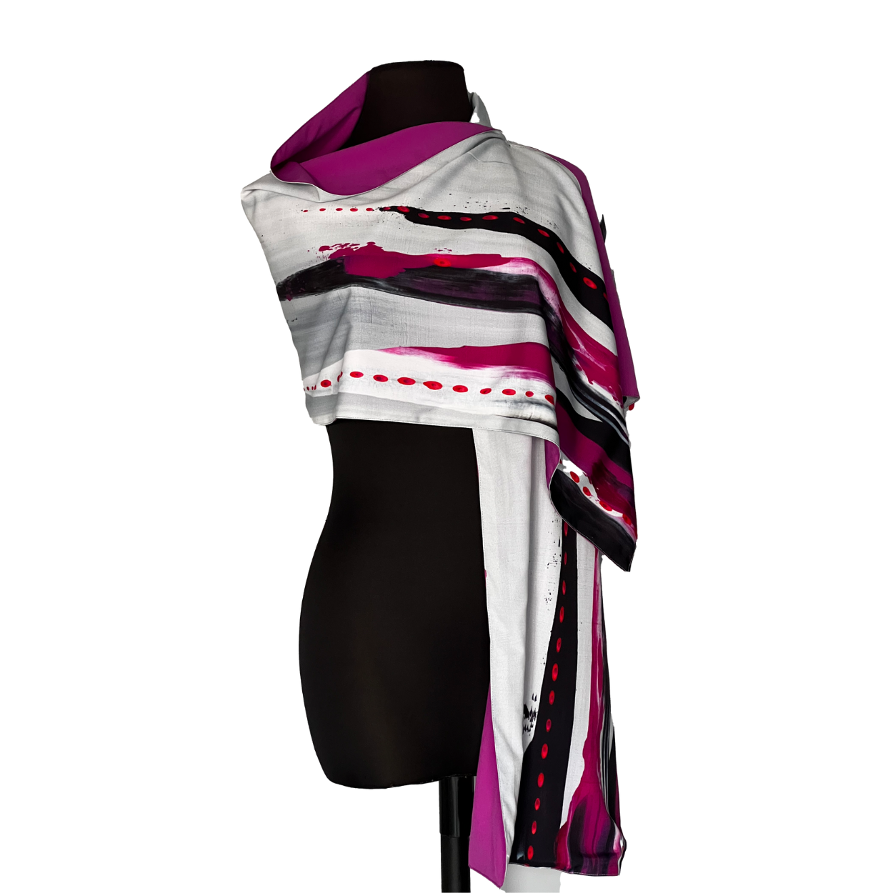 Abstract-print scarf draped over a black mannequin. It features shades of white, pink, purple, and black.