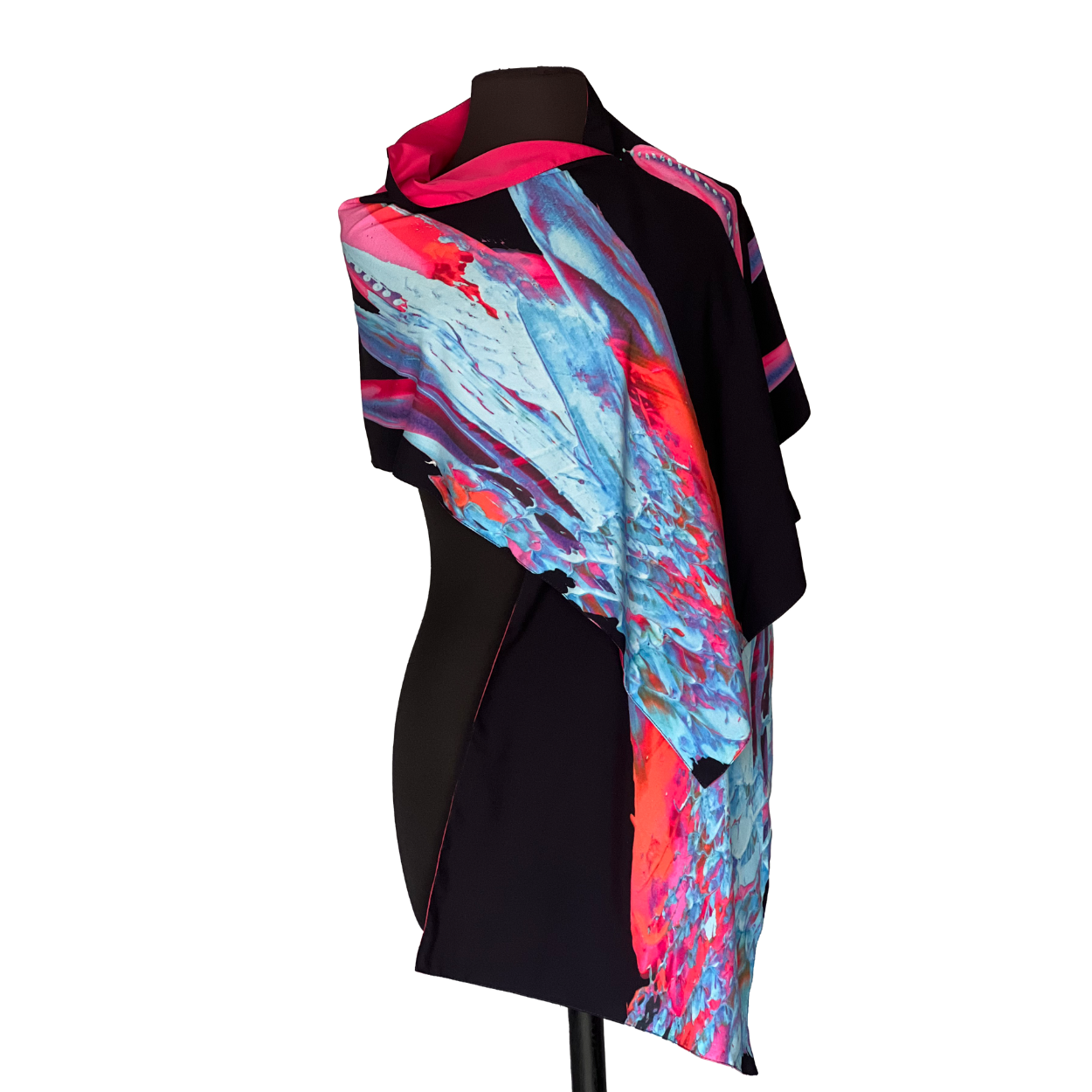 Black dress form with a scarf in shades of blue, pink, and red.