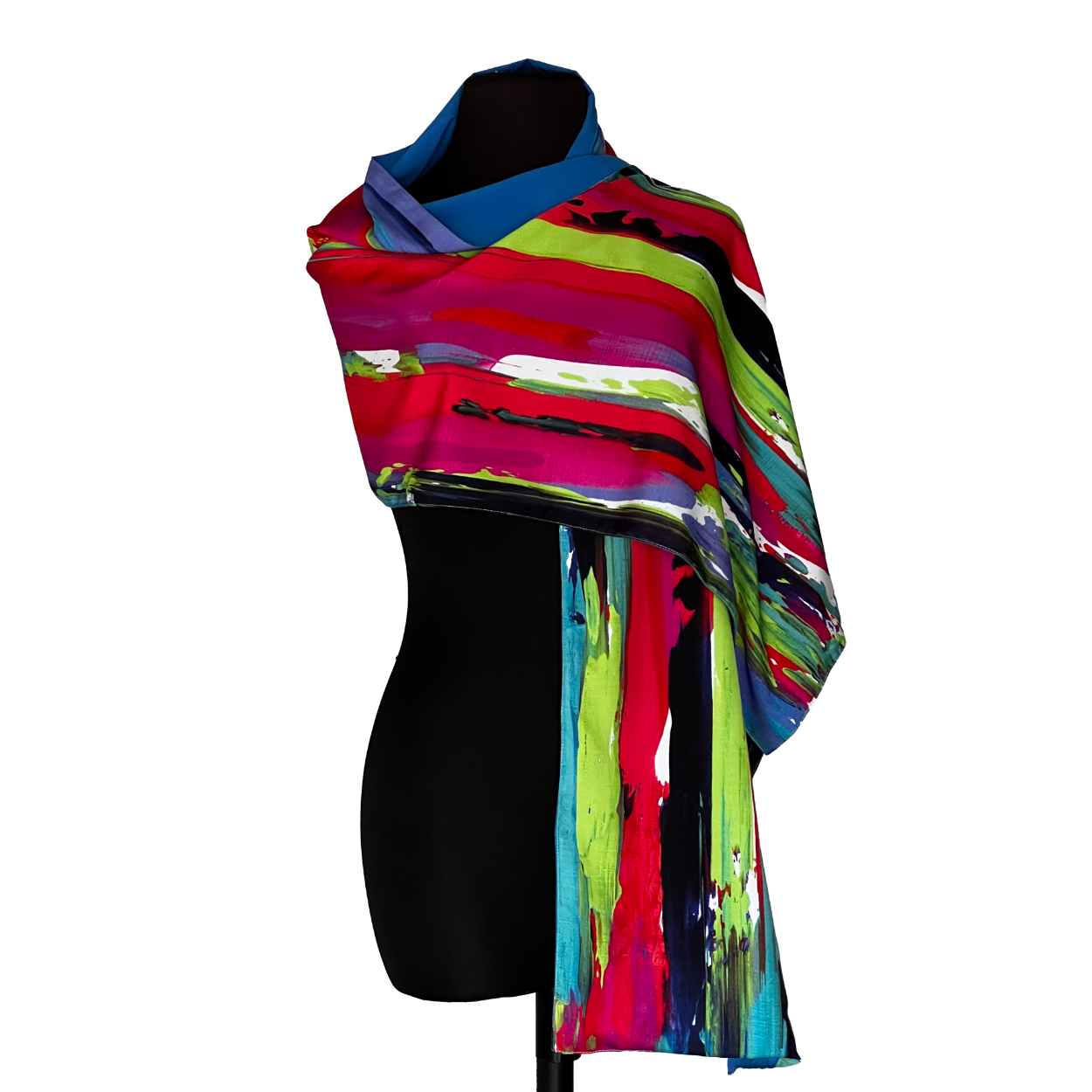 Abstract patterned scarf draped over a black mannequin, featuring strokes of red, green, blue, and black.