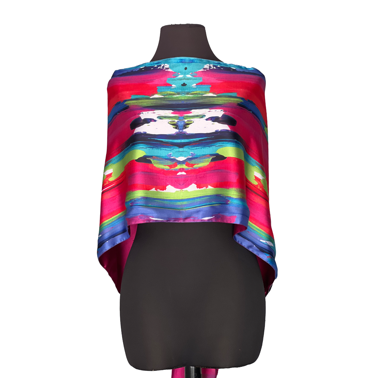 Colorful abstract silk scarf draped over a black mannequin, against a white background.