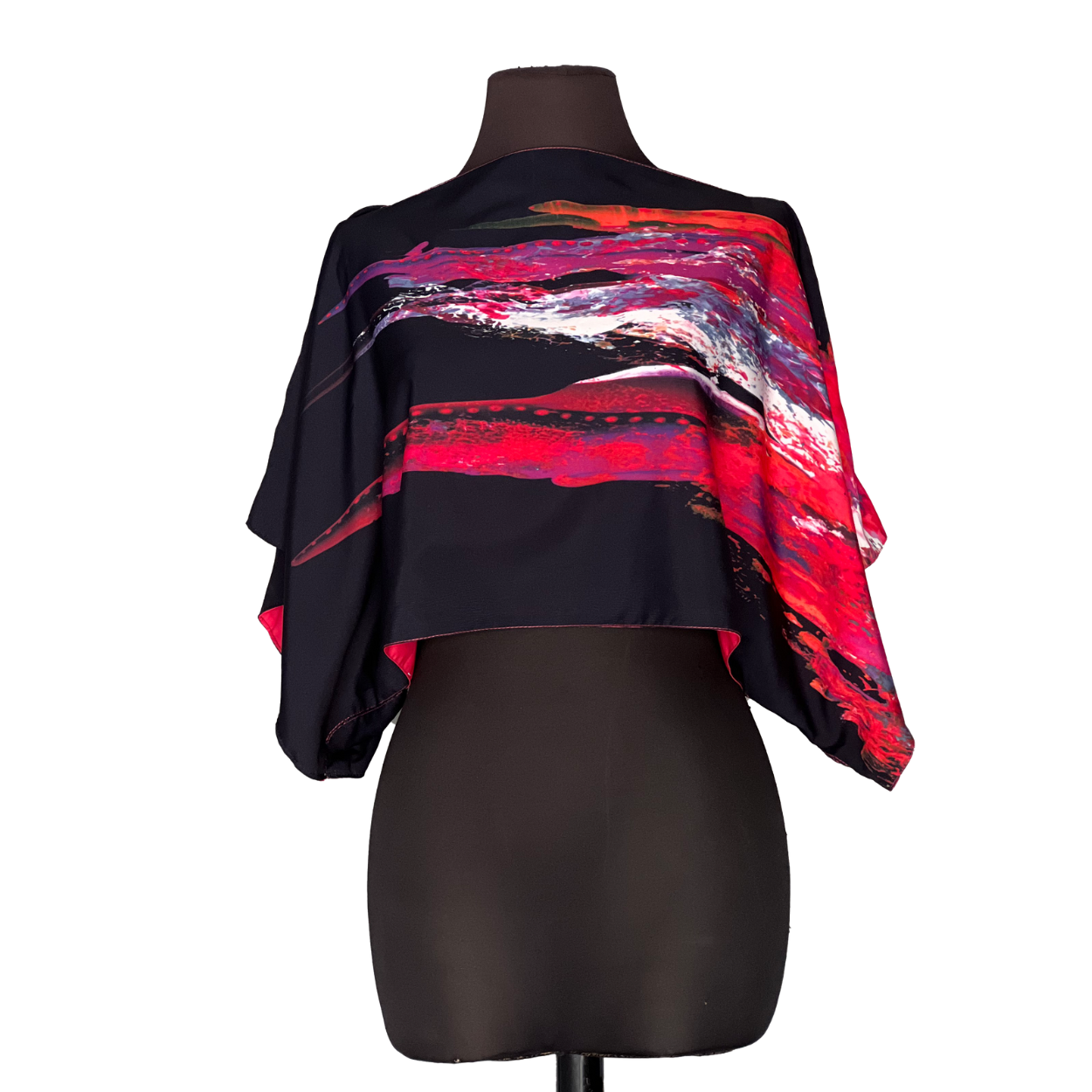 Black crop top with red, white, and purple brushstroke design on a black mannequin.