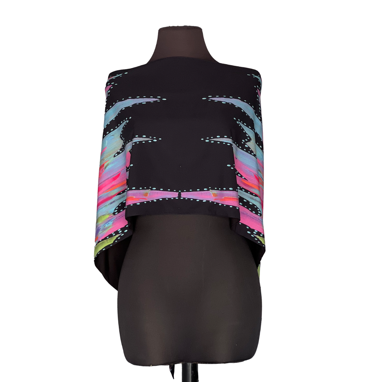 Black cape with colorful striped design on a mannequin.
