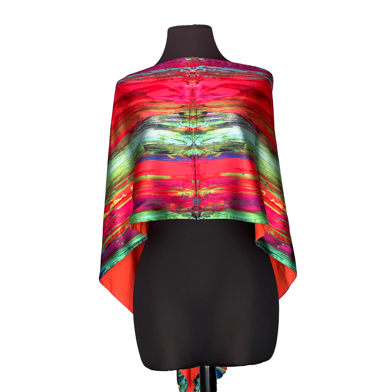 Silk scarf with a colorful, abstract pattern draped on a black mannequin.