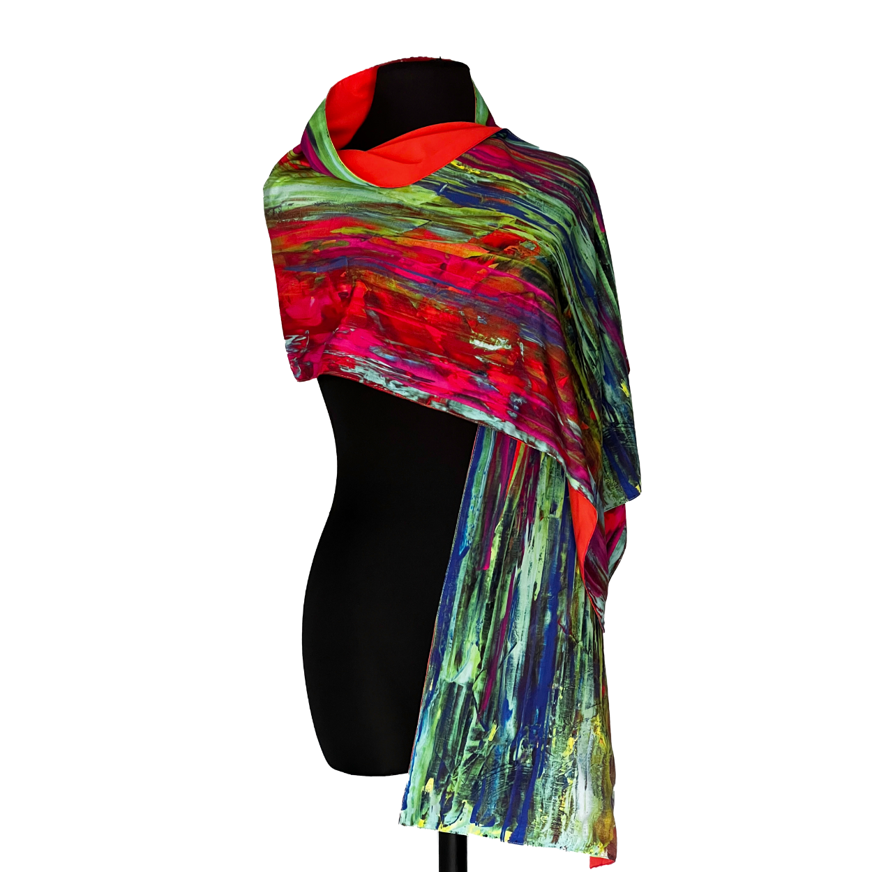 Colorful abstract printed scarf draped over a black mannequin.