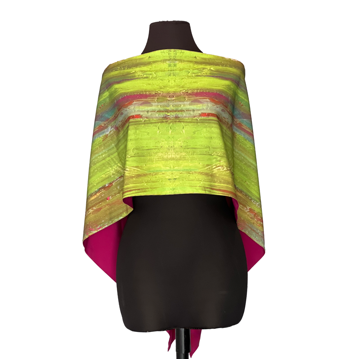Lime green and fuchsia reversible cape on a black mannequin, with a striped pattern.
