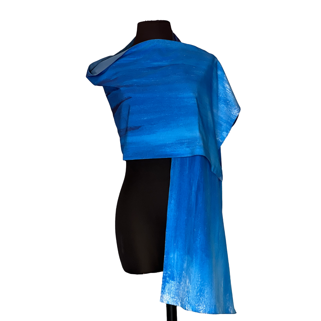 Blue silk shawl draped over a black mannequin.