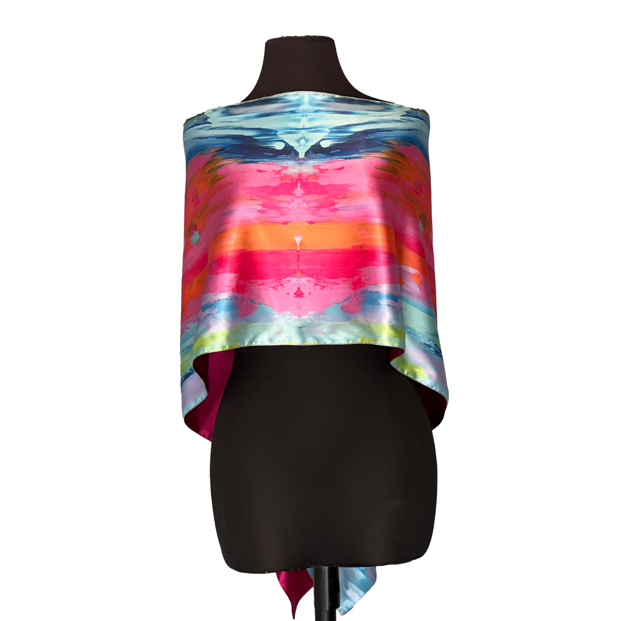 Silk scarf with a vibrant, abstract design on a black mannequin.