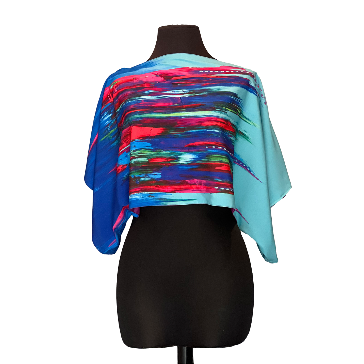 Cropped blue, red, and turquoise abstract pattern top displayed on a black mannequin.