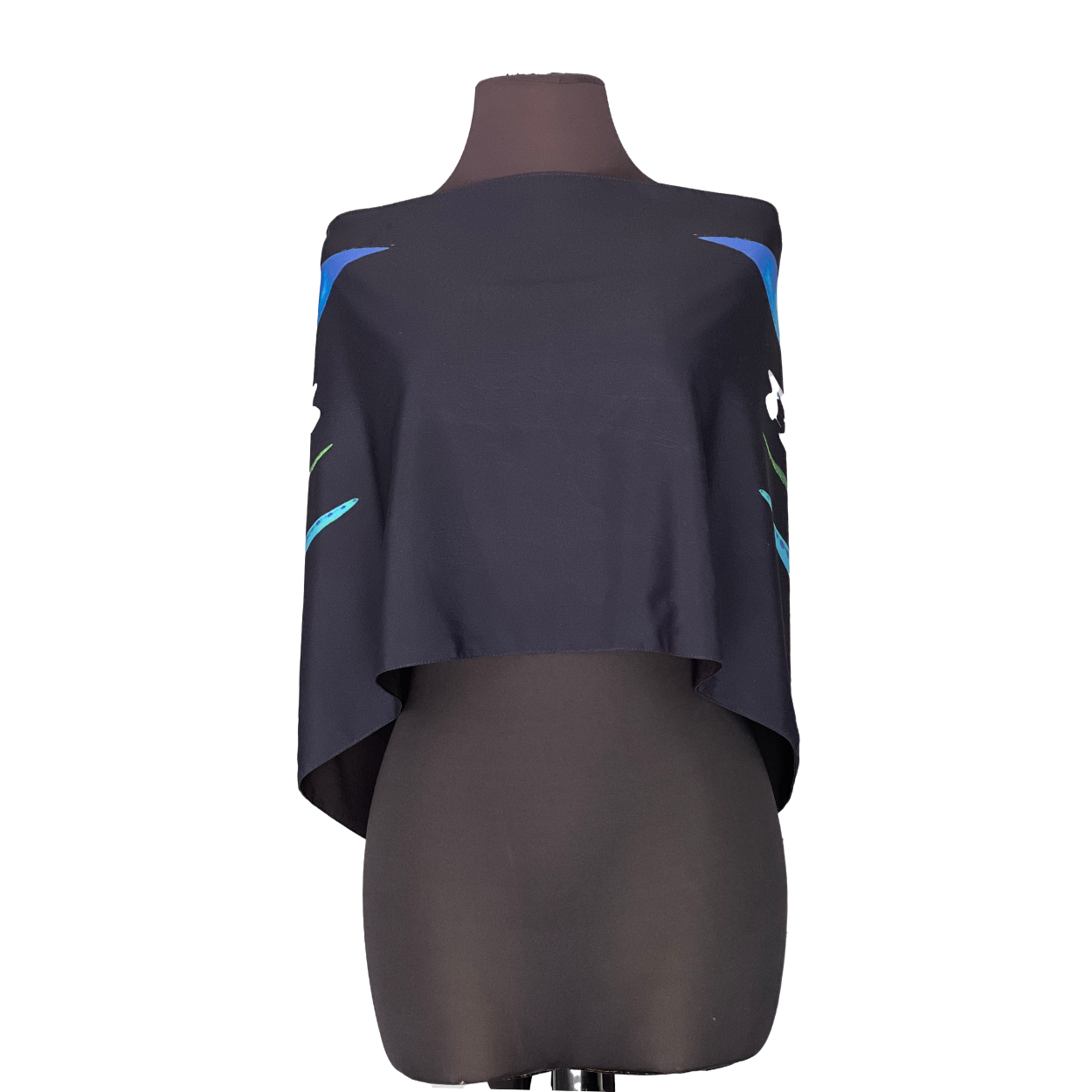 Dark blue poncho with blue and teal accents, displayed on a mannequin.