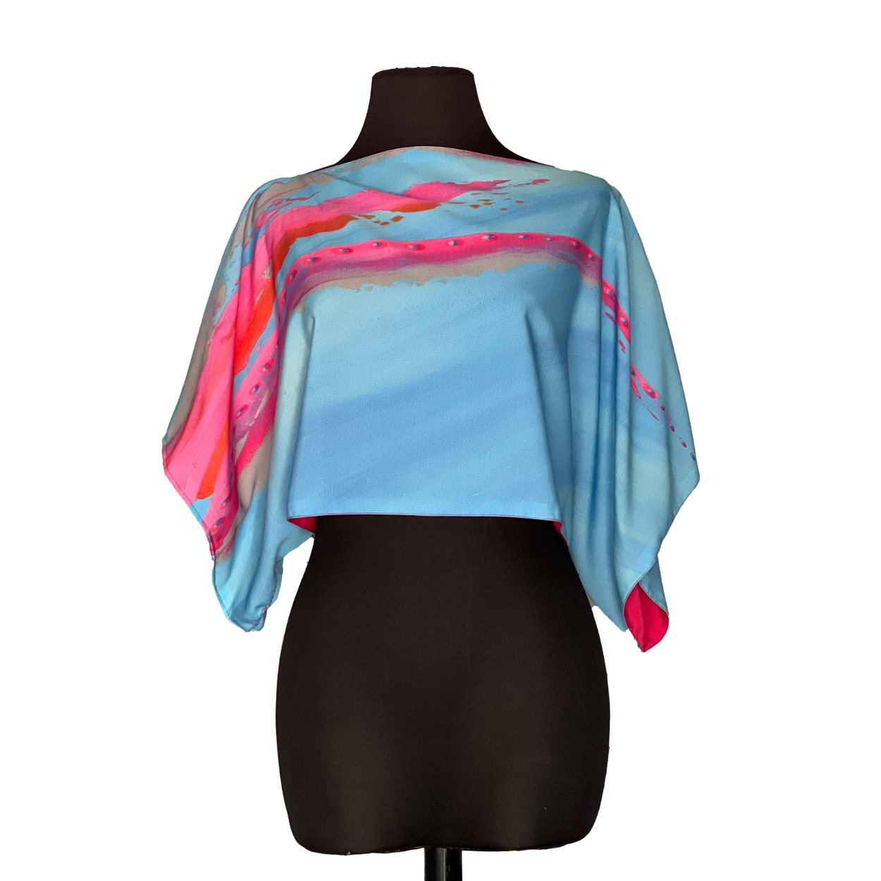 Blue and pink abstract patterned crop top on a black mannequin.