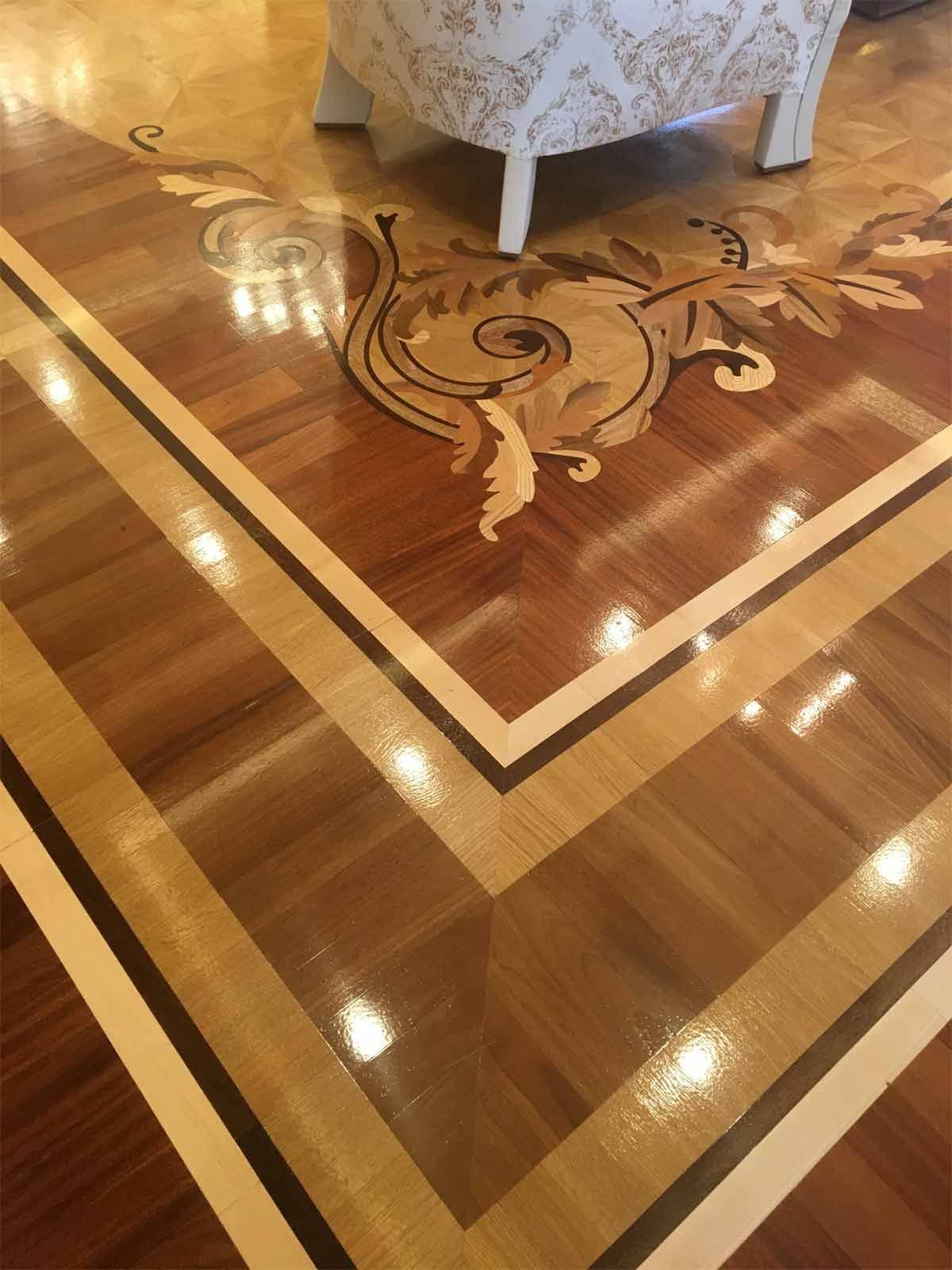 A wooden floor with a chair in the background