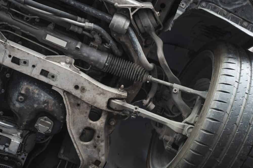 A Close up Of the Underside of A Car with A Tire — Tweed Exhaust & Mechanical In Tweed Heads South, NSW